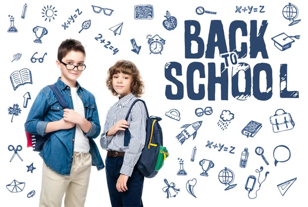 Two schoolboys with backpacks looking at camera isolated on white, with icons and 
