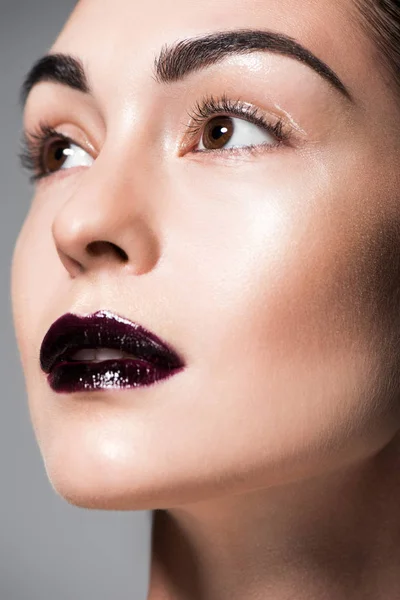 Close up portrait of beautiful model with black lips, isolated on grey — Stock Photo