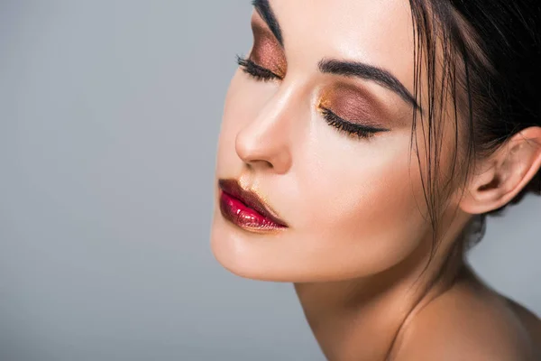 Portrait of young tender woman with fashionable makeup, isolated on grey — Stock Photo