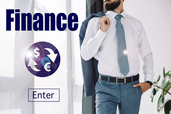 Cropped view of businessman holding jacket and standing near window with finance sign — Stock Photo