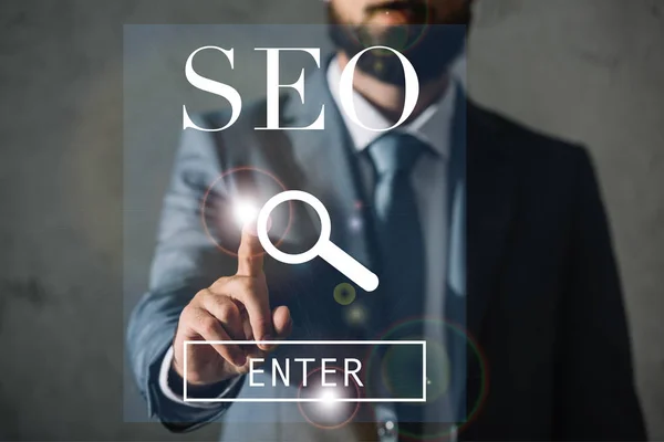 Cropped view of professional developer touching SEO search — Stock Photo