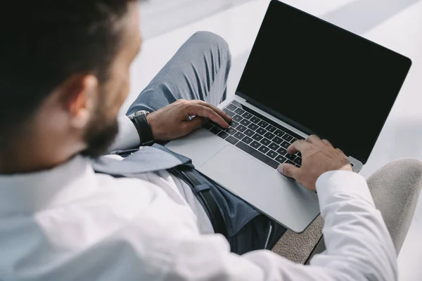 Cropped view of businessman typing on laptop with copy space — Stock Photo