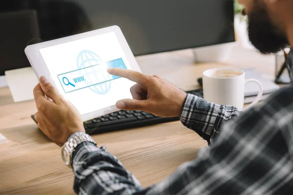 Cropped shot of seo manager using tablet with website on screen — Stock Photo