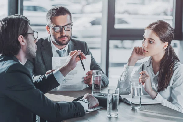 Group of business people with contracts having meeting at modern office — Stock Photo
