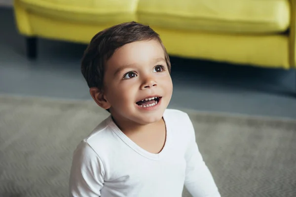 Portrait of adorable excited child at home — Stock Photo