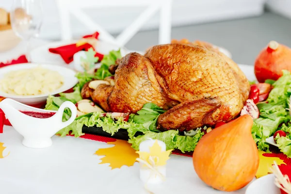 Delicious baked turkey on served table for thanksgiving dinner — Stock Photo