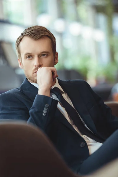 Portrait of thoughtful businessman resting in coffee shop — Stock Photo