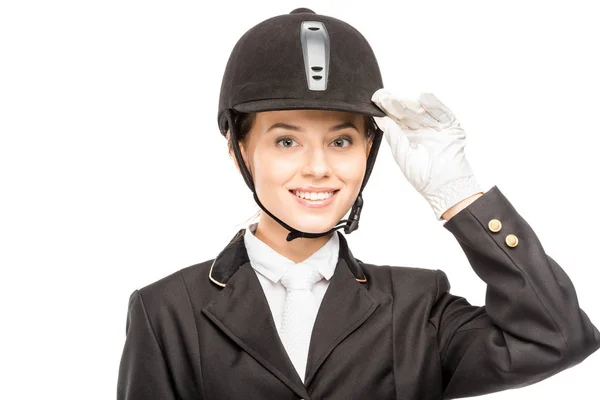 Close-up portrait of smiling young horsewoman in safety helmet looking at camera isolated on white — Stock Photo