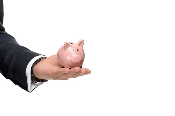 Cropped image of businessman holding pink piggybank isolated on white — Stock Photo