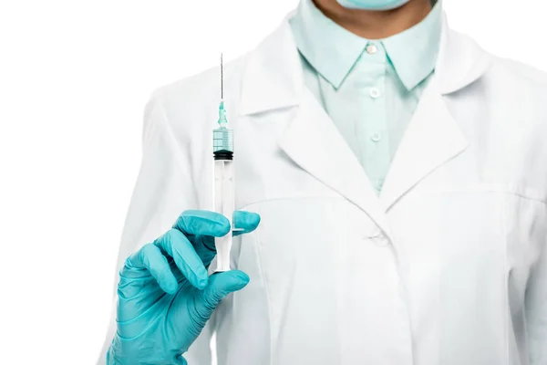 Cropped image of female doctor in medical mask holding syringe isolated on white — Stock Photo