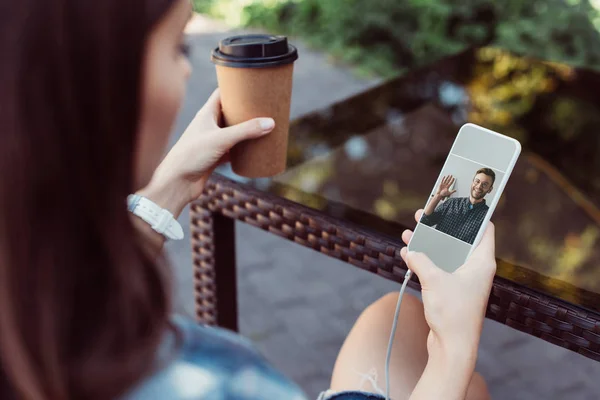 Colleagues having video chat with smartphone outdoors — Stock Photo