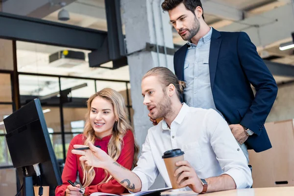 Business team working on business project together at workplace with notebooks in office — Stock Photo