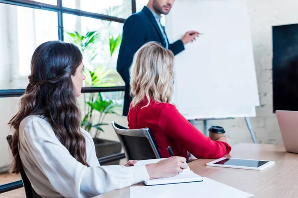 Partial view of businessman and businesswomen having meeting in office — Stock Photo