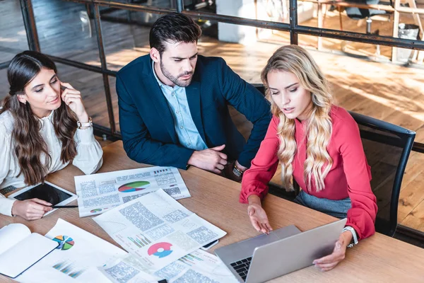 High angle view of business team working on new business idea together at workplace with papers in office — Stock Photo