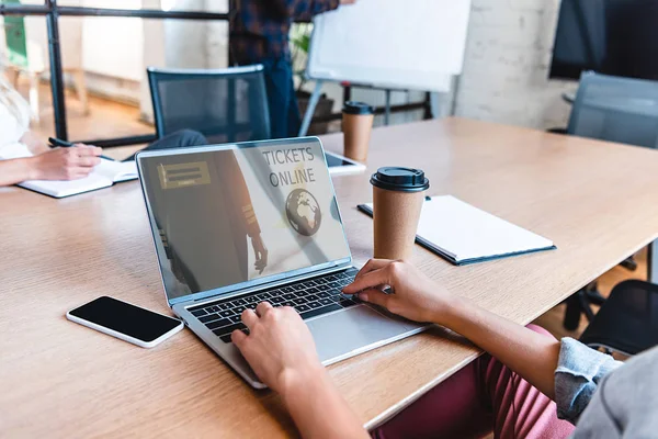 Cropped shot of business person using laptop with tickets online website on screen — Stock Photo