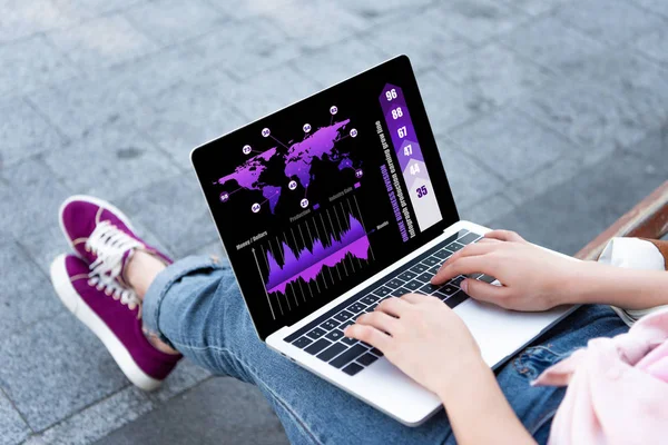 Cropped image of woman using laptop with business appliance on street — Stock Photo