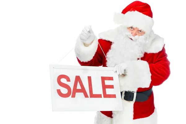 Santa claus tenant conseil de réduction avec signe de vente isolé sur blanc — Photo de stock