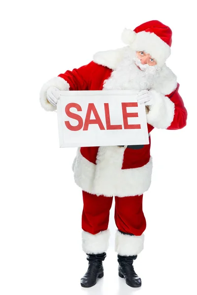 Santa claus en costume rouge tenant conseil de vente isolé sur blanc — Photo de stock