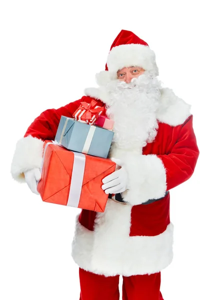 Sorrindo santa claus com natal apresenta-se isolado em branco — Fotografia de Stock