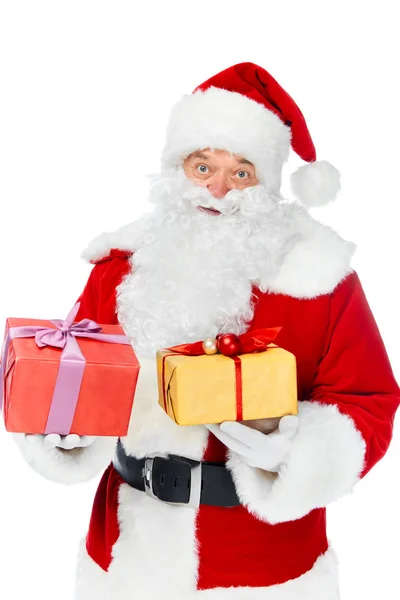 Santa claus in hat with christmas gift boxes isolated on white — Stock Photo