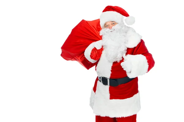 Щасливий Санта Клаус з різдвяною сумкою, що показує великий палець вгору ізольовано на білому — стокове фото