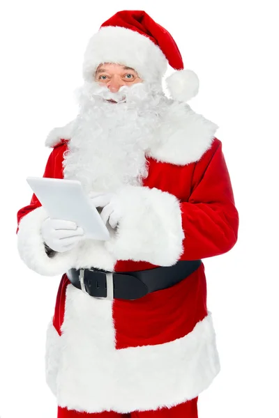 Happy santa claus using digital tablet isolated on white — Stock Photo