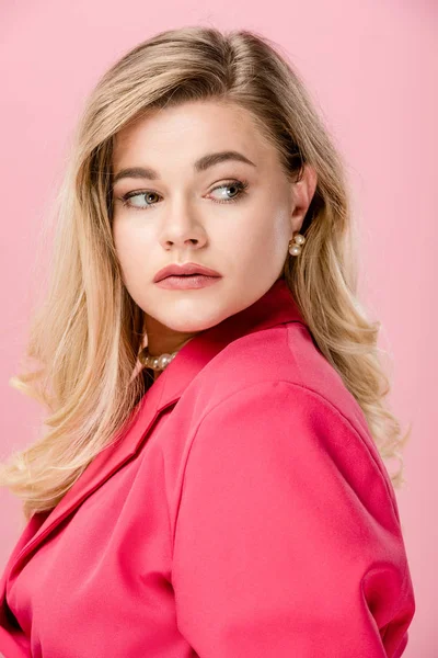 Attractive oversize girl in pink trench coat posing isolated on pink — Stock Photo