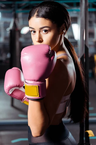 Attractive sportive girl in boxing box gloves in sports gym — Stock Photo