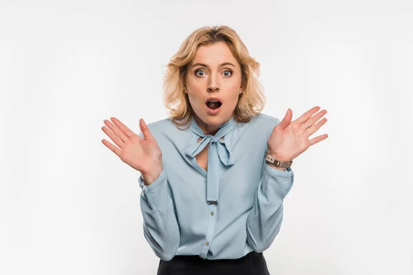 Shocked businesswoman gesturing with hands and looking at camera isolated on white — Stock Photo