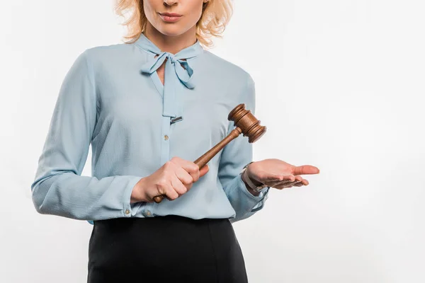 Cropped shot of judge holding wooden hammer isolated on white — Stock Photo