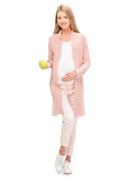 Bella donna incinta che tiene mela verde isolata su bianco — Foto stock