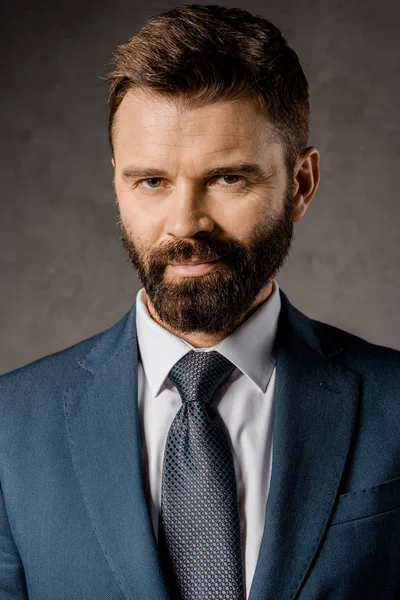 Close up of successful bearded businessman in formalwear — Stock Photo