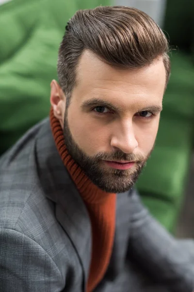 Portrait of serious man in formal wear looking at camera — Stock Photo