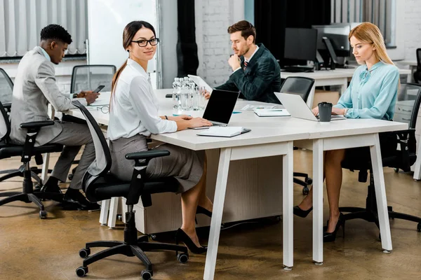 Group of multicultural business colleagues working in office — Stock Photo