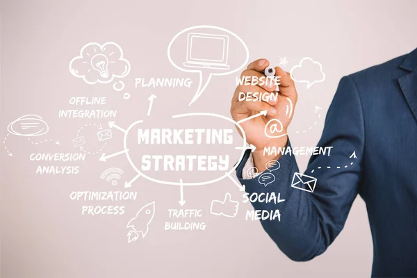 Partial view of businessman writing marketing strategy with marker isolated on grey — Stock Photo