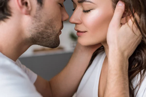 Close up of attractive woman and sensual man with closed eyes — Stock Photo