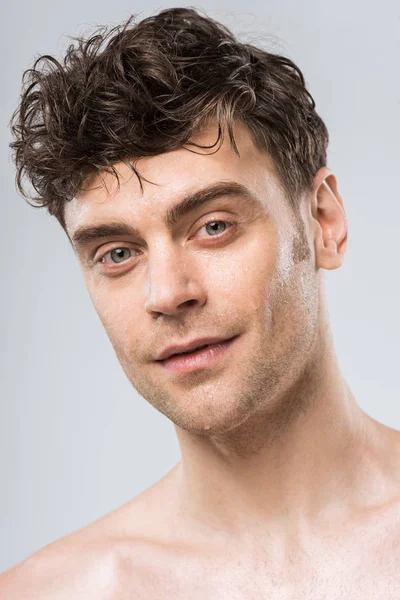 Portrait of brunette young sexy man isolated on grey — Stock Photo