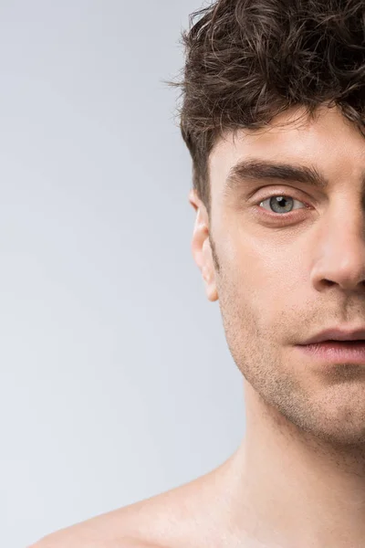 Portrait of handsome young man isolated on grey — Stock Photo