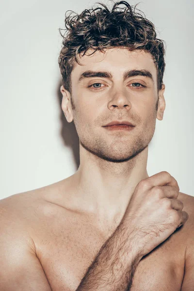 Portrait of handsome young man on grey — Stock Photo