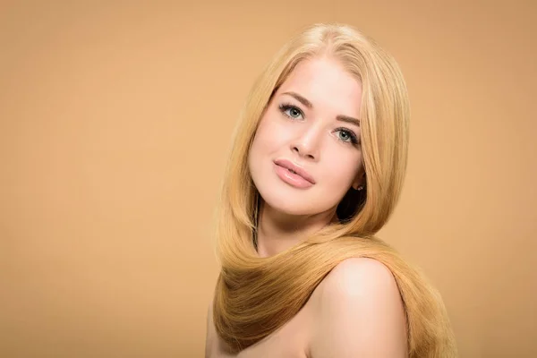 Front view of girl with shiny blonde hair around neck — Stock Photo