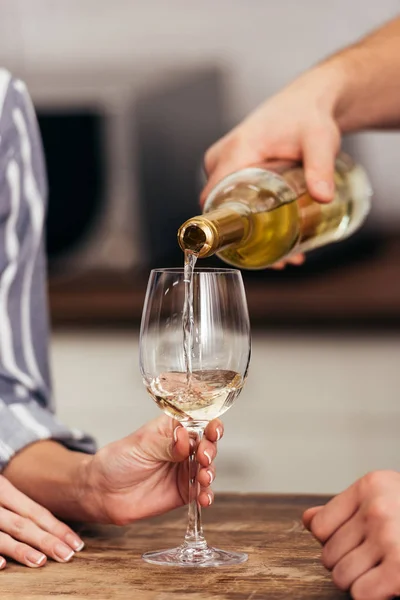 Cropped view of of boyfriend pouring wine for girlfriend — Stock Photo