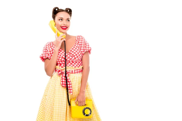 Stylish pin up girl talking on vintage yellow phone — Stock Photo