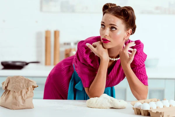Tired pin up girl with flour traces on hands and face — Stock Photo