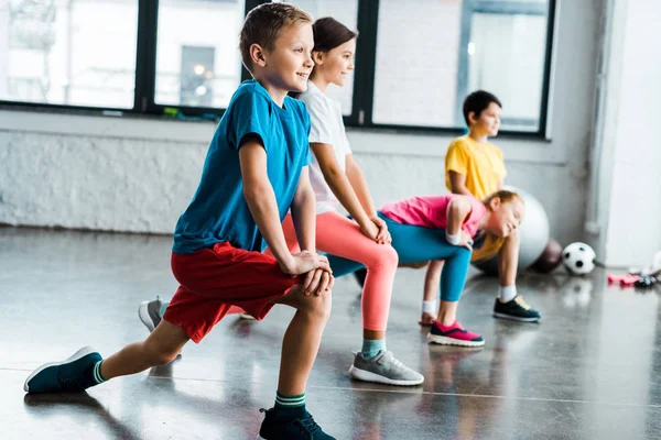 Kids warming up before training in gym — Stock Photo