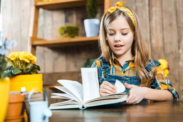 Selective focus of adorable kid reading book — Stock Photo