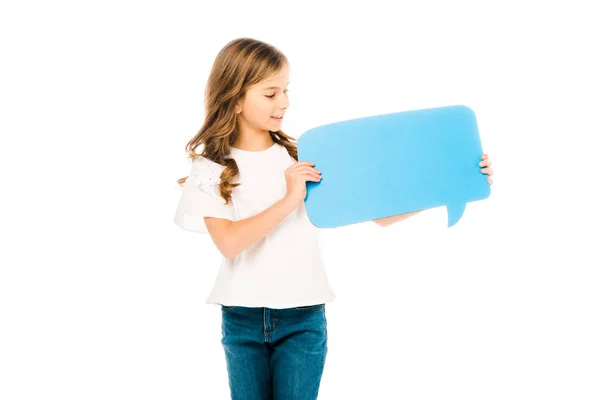 Adorable child in white t-shirt and blue jeans holding speech bubble isolated on white — Stock Photo