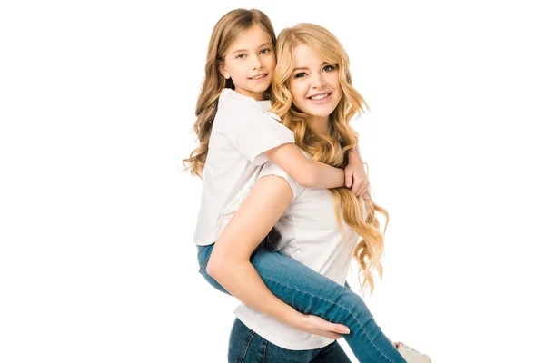 Happy mother piggybacking adorable daughter isolated on white — Stock Photo