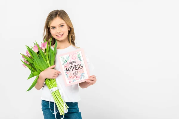 Adorable child with bouquet of beautiful pink tulips and happy mothers day greeting card on white background — Stock Photo