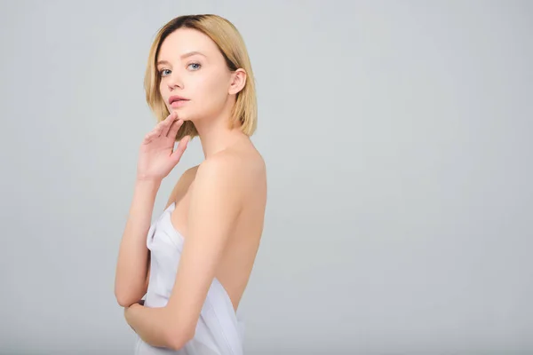 Blonde nude young woman posing in elegant white veil, isolated on grey — Stock Photo