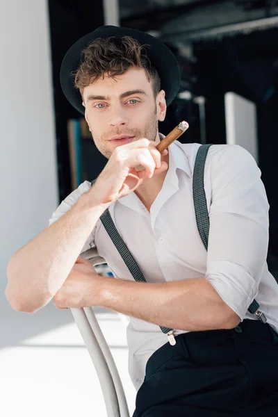 Good-looking man in trendy clothing smoking cigarette — Stock Photo